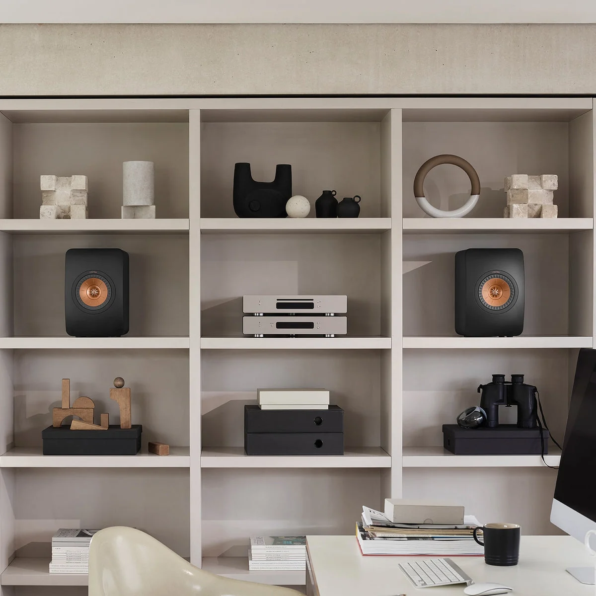 KEF LS50 Meta speakers in a refined home workspace