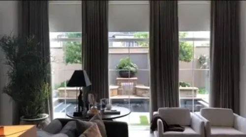 Shade Innovations Nano Box shades installed across living room windows